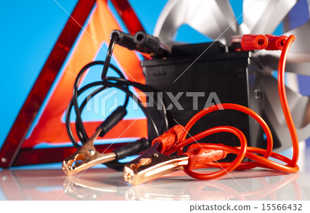 Car battery with two jumper cables clipped  15566432