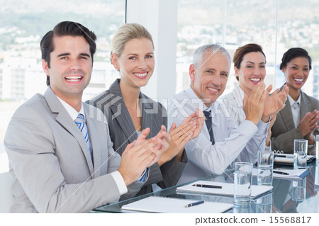 Business team applauding during conference Business team applauding during conference 15568817