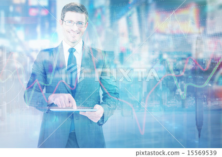 Composite image of businessman using his tablet pc 15569539