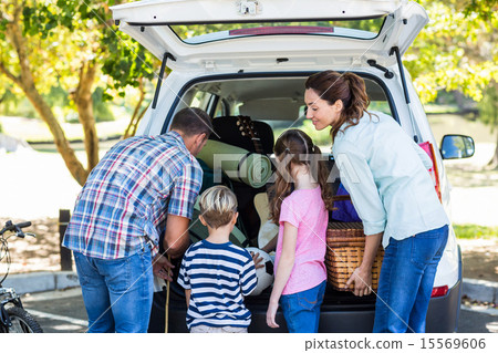 Stock Photo: Happy family getting ready for road trip