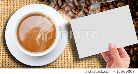 Composite image of hand showing card 15569807