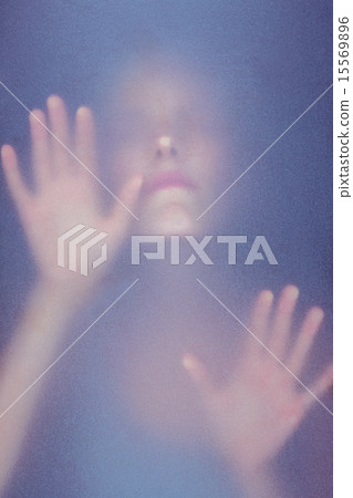 Blonde woman touching frosted glass Blonde woman touching frosted glass 15569896