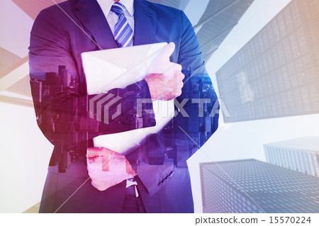 Composite image of businessman holding his laptop tightly Composite image of businessman holding his laptop tightly 15570224