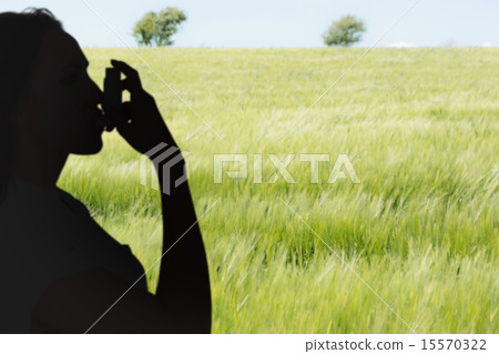 Composite image of asthmatic brunette using her inhaler Composite image of asthmatic brunette using her inhaler 15570322