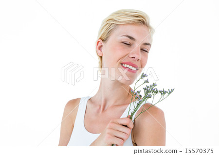 Gorgeous blonde woman smelling flowers Gorgeous blonde woman smelling flowers 15570375