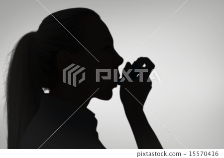 Composite image of pretty blonde using an asthma inhaler Composite image of pretty blonde using an asthma inhaler 15570416