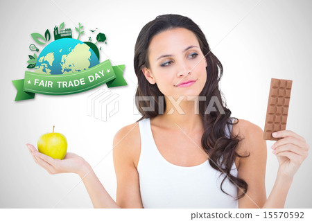 Composite image of pretty brunette deciding between apple and ch Composite image of pretty brunette deciding between apple and ch 15570592