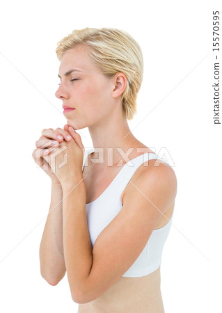 Pretty blonde woman praying 15570595