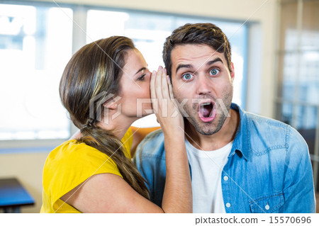 Casual business team whispering 15570696