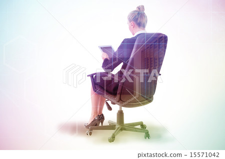 Composite image of businesswoman sitting on swivel chair with ta 15571042