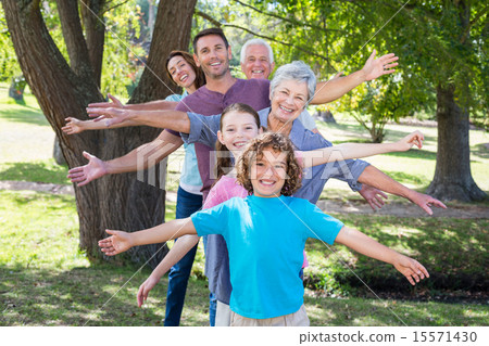 Extended family smiling in the park 15571430