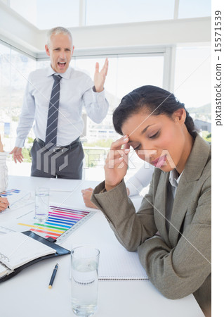 Businessman yelling at his colleague Businessman yelling at his colleague 15571539