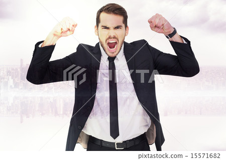 Composite image of furious businessman tensing arms muscle 15571682