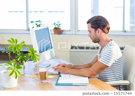 Casual businessman typing on keyboard 15571744