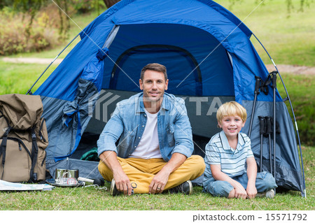 Father and son having fun in the park Father and son having fun in the park 15571792