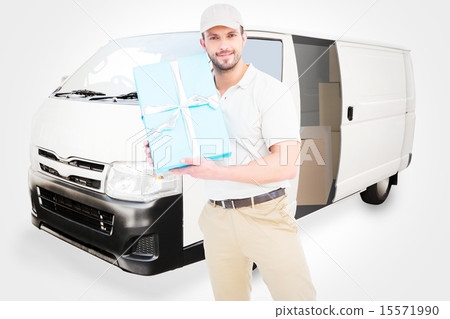 Composite image of delivery man with cardboard box 15571990