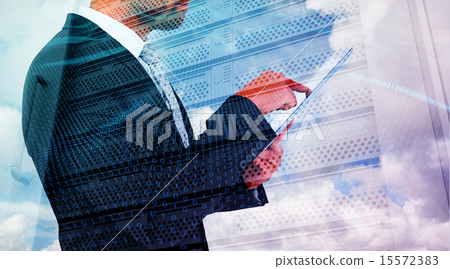 Composite image of businessman using his tablet pc 15572383