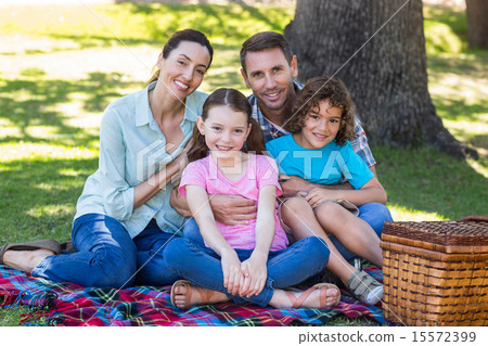 Happy family on a picnic in the park 15572399