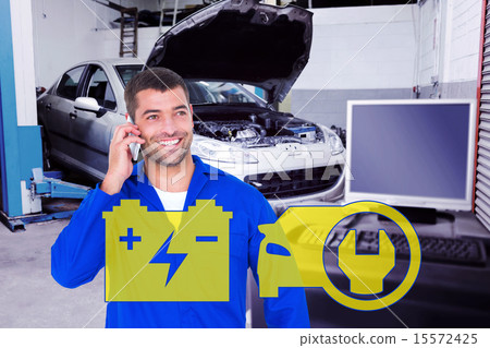 Composite image of smiling male mechanic using mobile phone Composite image of smiling male mechanic using mobile phone 15572425