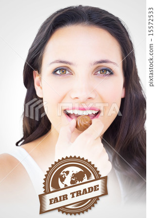 Composite image of pretty brunette eating chocolate candy Composite image of pretty brunette eating chocolate candy 15572533
