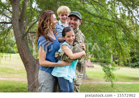 Handsome soldier reunited with family 15572902