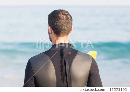 Man in wetsuit with a surfboard on a sunny day Man in wetsuit with a surfboard on a sunny day 15573193