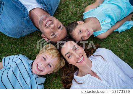 Happy family in the park together 15573529