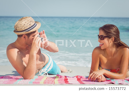 happy couple taking photo 15573772