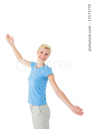 Blonde woman standing arms outstretched Blonde woman standing arms outstretched 15573779