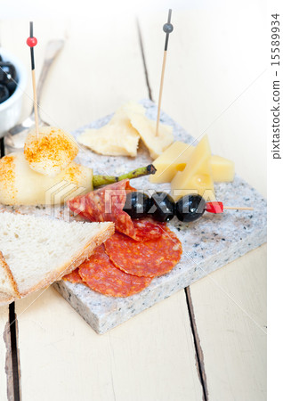 mix cold cut on a stone with fresh pears mix cold cut on a stone with fresh pears 15589934