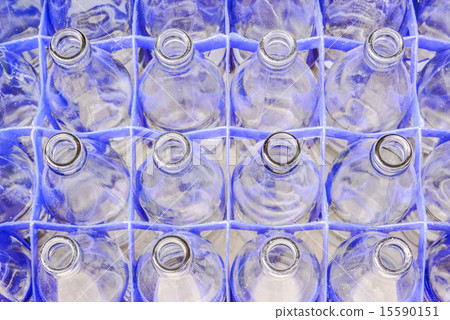 Used glass bottles waiting for reuse  15590151