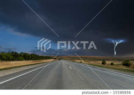 Road under stormy clouds with lightning 15590956