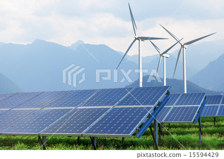 solar panels and wind turbines against mountains 15594429