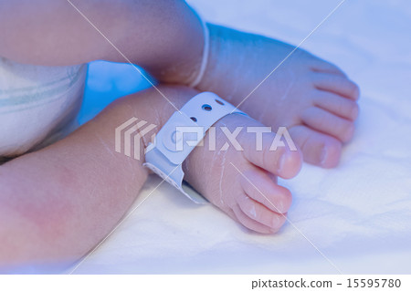 Newborn baby foot with identification tag name. 15595780