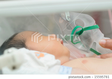 Baby patient in oxygen mask ,Making inhalation 15595781
