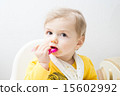 Cute baby eating 15602992