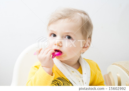 Cute baby eating Cute baby eating 15602992