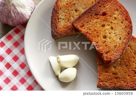 fried bread and garlic 15603959
