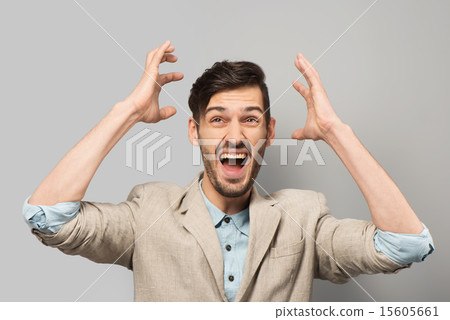 Young man cheerfully smiling Young man cheerfully smiling 15605661