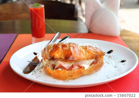 Croissant sandwich with ham, cheese and eggs Croissant sandwich with ham, cheese and eggs 15607022