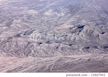 Andean mountain range in Chile of South America, pattern carved on dry sand ground Andean mountain range in Chile of South America, pattern carved on dry sand ground 15607943