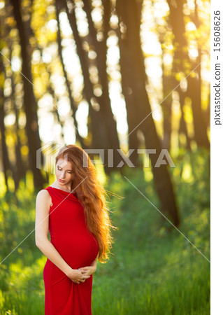 Young  pregnant woman relaxing and enjoying life in nature 15608626