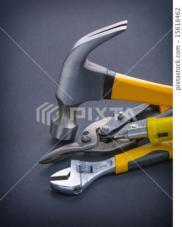 圖庫照片: screwdriver claw hammer adjustable wrench with yellow