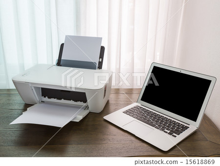 printer and Laptop on wood table 15618869