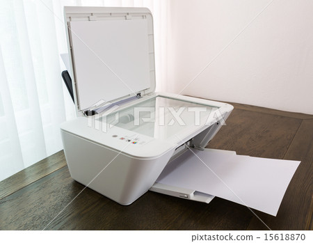Printer with blank paper on a wood table 15618870