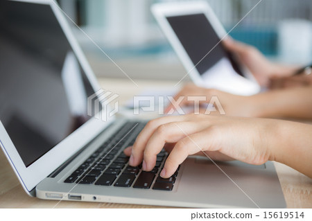 Closeup of business woman hand typing on laptop 15619514