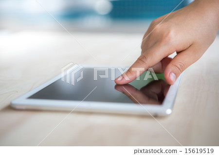Woman hand touch  white tablet with blank screen 15619519