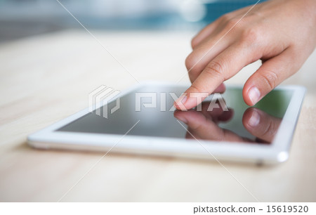 Woman hand touch  white tablet with blank screen 15619520