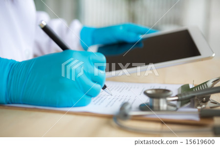 Doctor using tablet computer Doctor using tablet computer 15619600