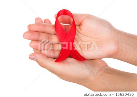 AIDS ribbon in hand isolated on white background 15620450